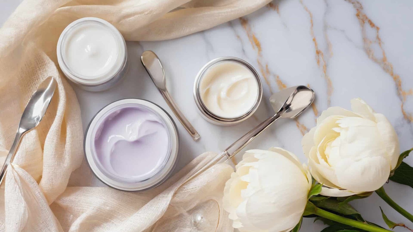 Best Night Creams for Women displayed on a clean luxury surface with glowing skincare aesthetic showing hydrating and anti-aging cream textures